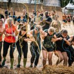 Participants linking arms through Electroshock Therapy