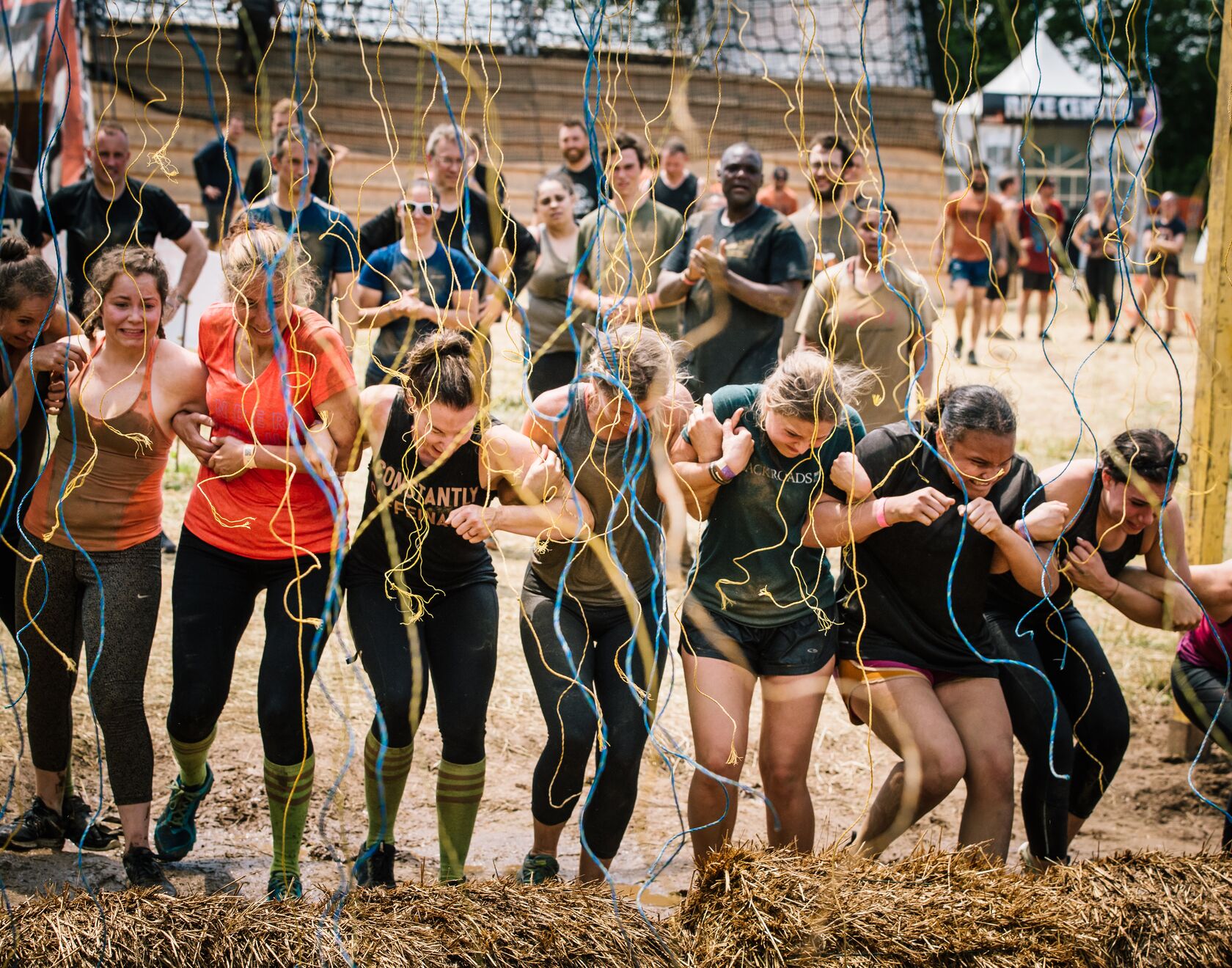 Participants linking arms through Electroshock Therapy