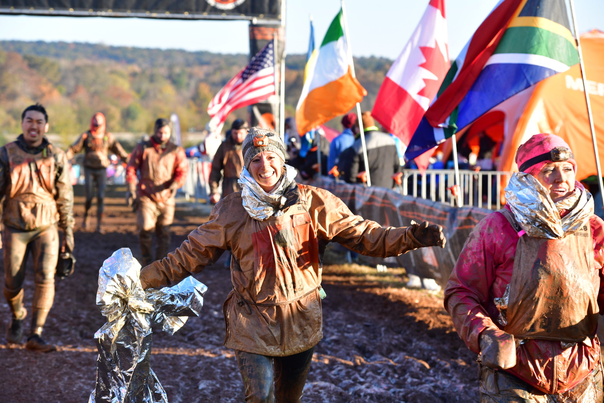 Participant running while holding an aluminum paper