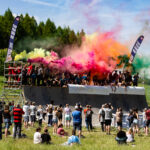 colourful flares on tough mudder obstacle