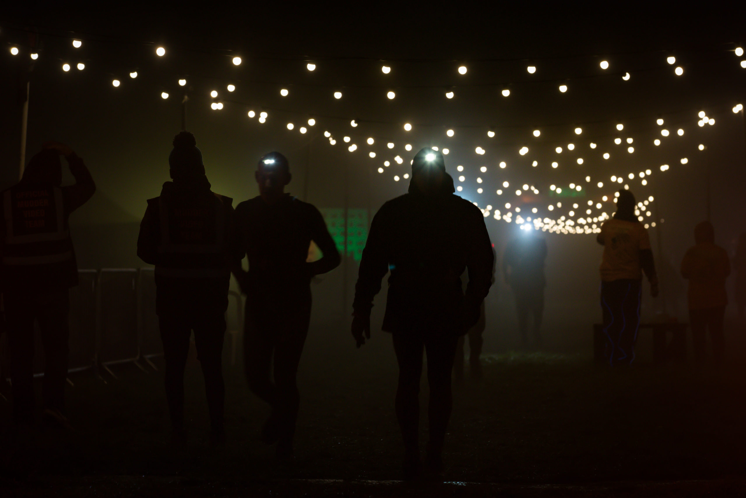 Figures in the dark with fairy lights