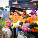 Volunteers placing headbands on people