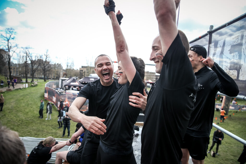 team of friends cheering Everest