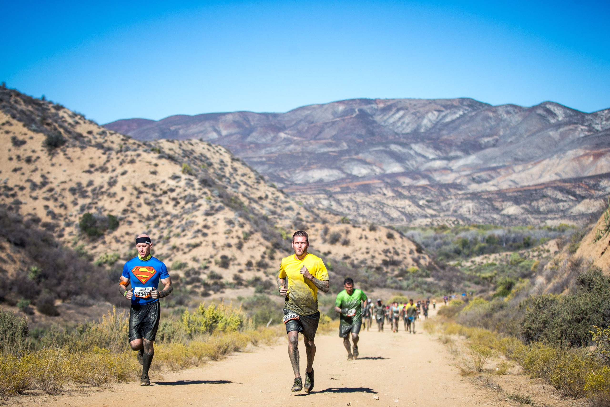 Participants running in the mountainside