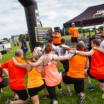 Volunteers kneeling together