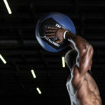 Man jumping with medicine ball