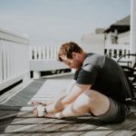 Man stretching outside