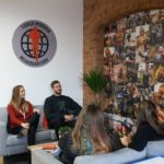 People chatting in Tough Mudder Headquarters